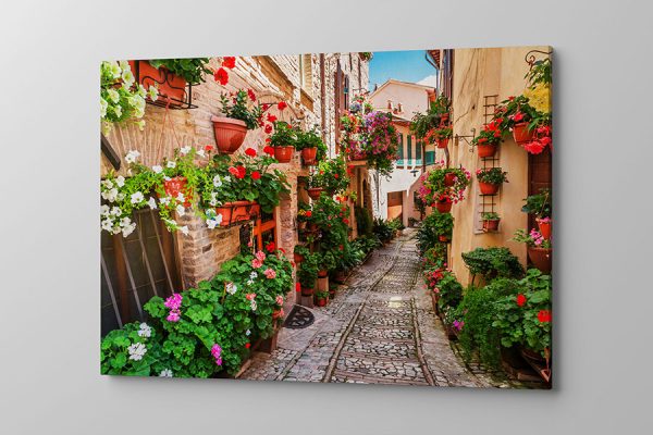 Obraz na płótnie kolorowa pełna kwiatów urokliwa uliczka